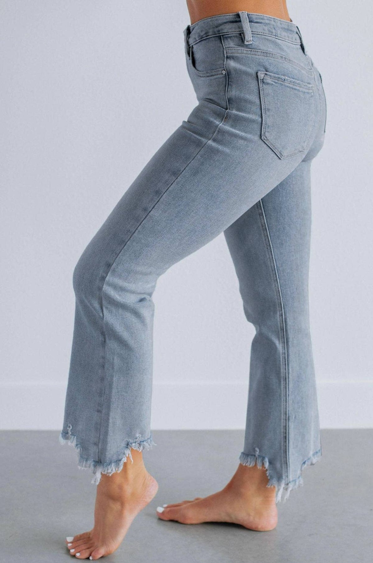 High-waisted ripped frayed straight-leg jeans